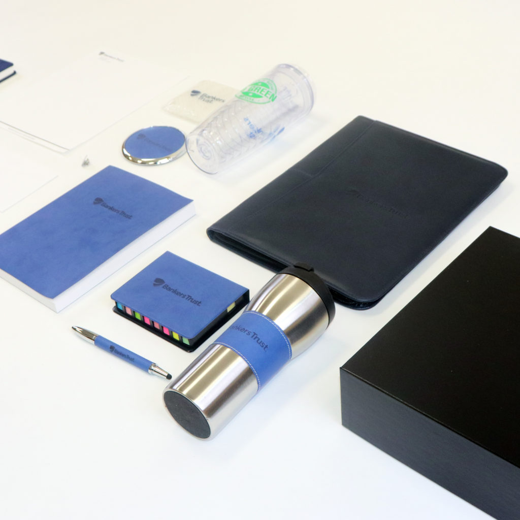 Bankers Trust promotional items including: notebooks, cups, padfolio, pens