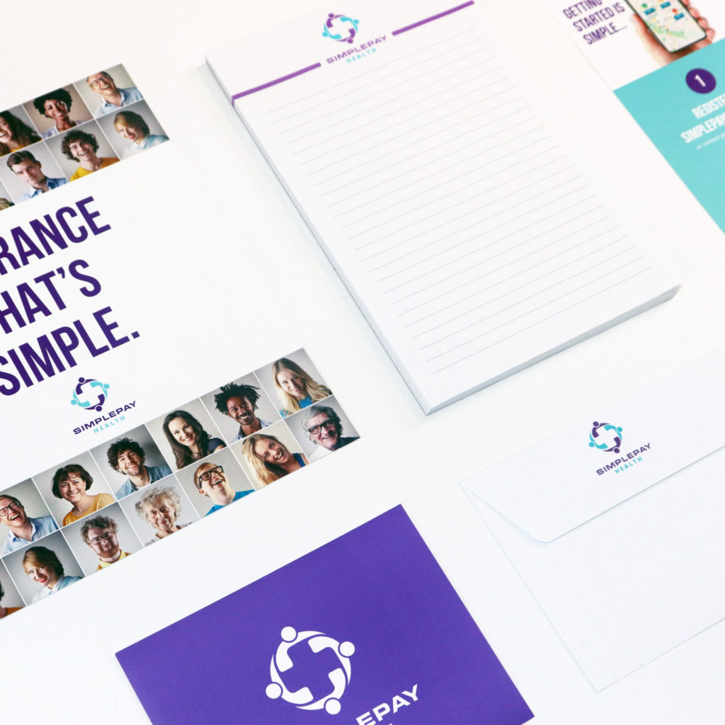 Simplepay Health promotional items including: envelopes, notepads, and other printed materials