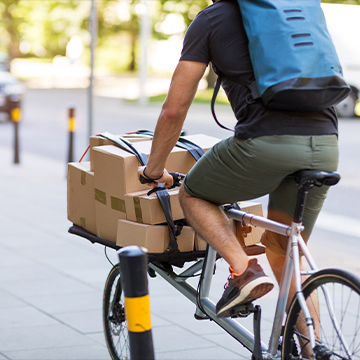 Man on bike with boxes for fullfillment